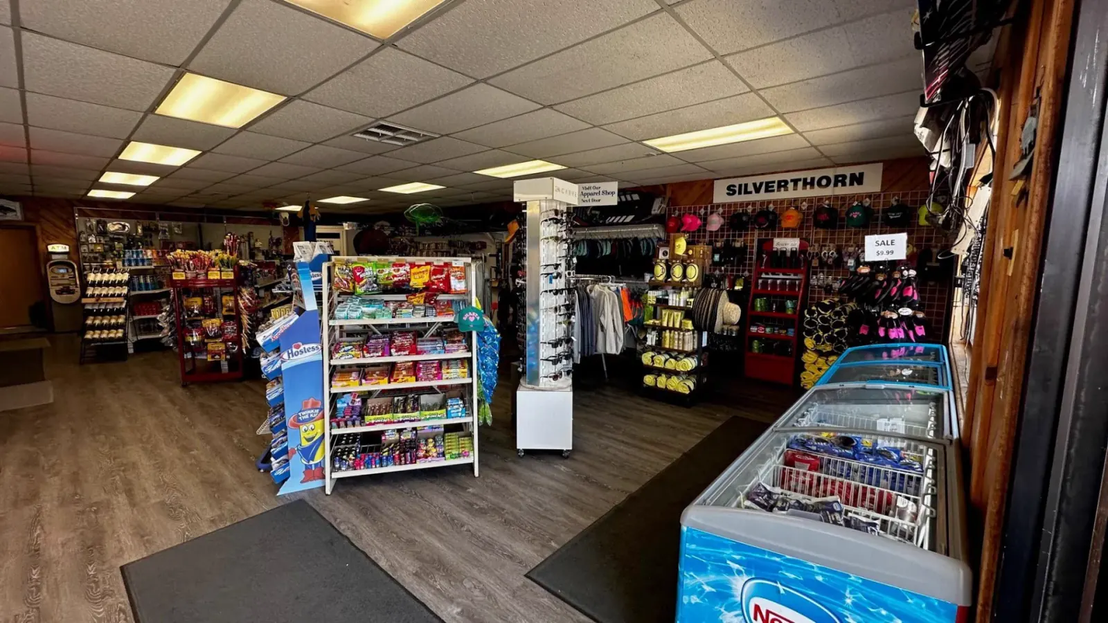 Inside the Silverthorn Resort apparel and pro shop with snacks, sunglasses, hats, swimwear and souvenirs on Shasta Lake