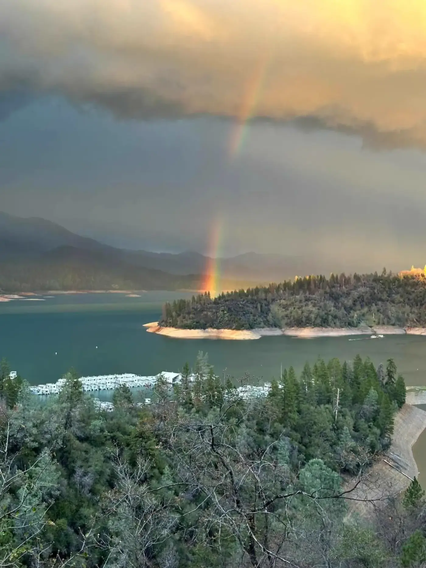 Double rainbow over Silverthorn Resort marina on the Pit River Arm of Shasta Lake after a storm