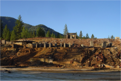 Exposed concrete foundation near Shasta Dam along the Shasta Lake shoreline at low water