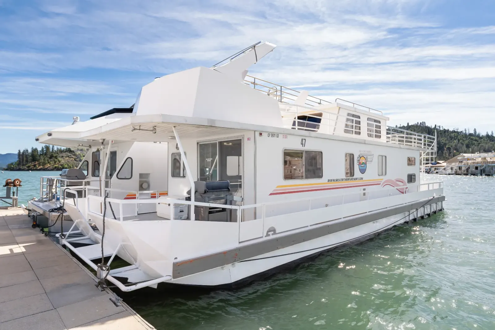 Senator houseboat docked at Silverthorn Resort marina Shasta Lake showing full exterior deck layout