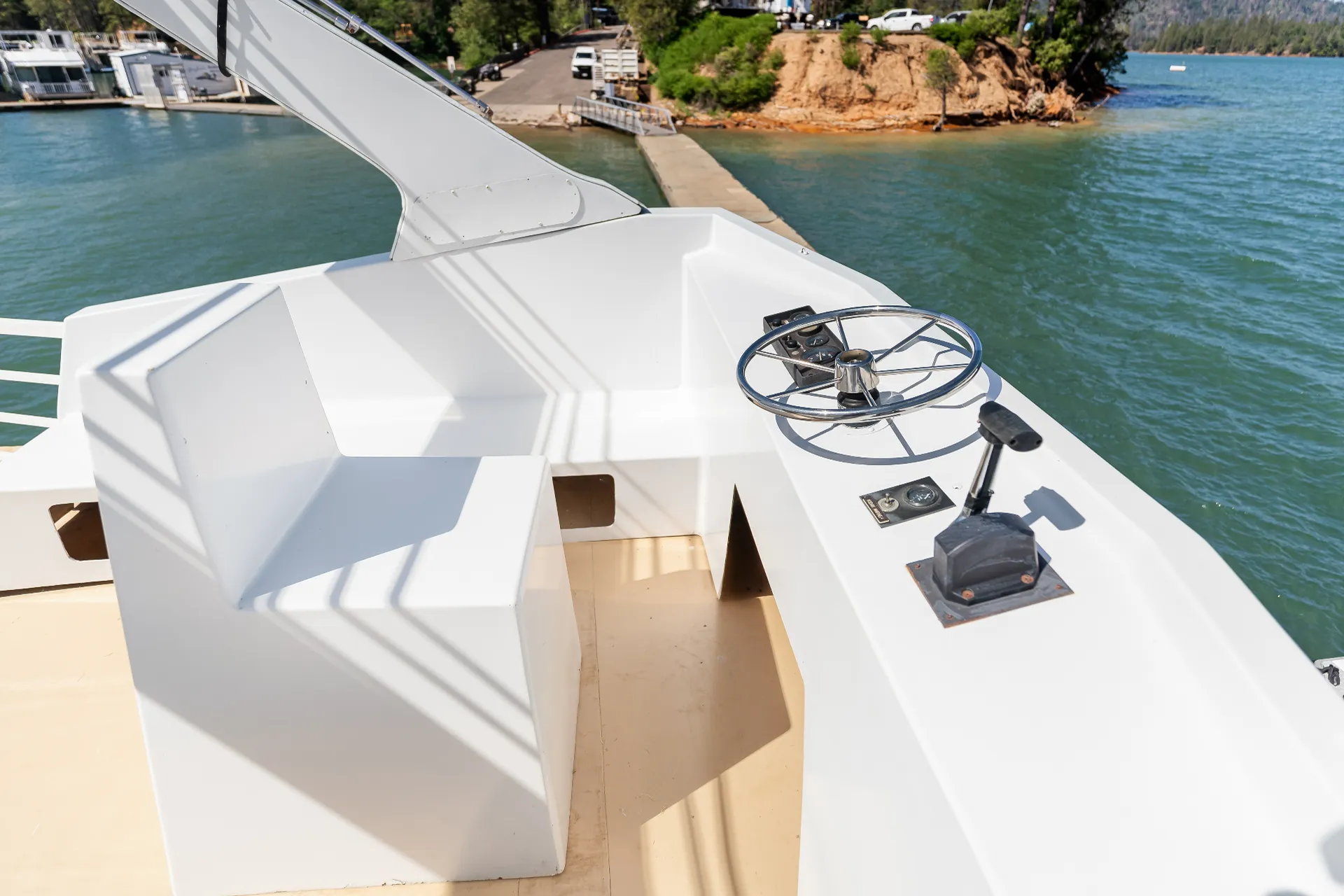 Senator houseboat captain fly bridge helm station with dual controls and 360-degree lake visibility