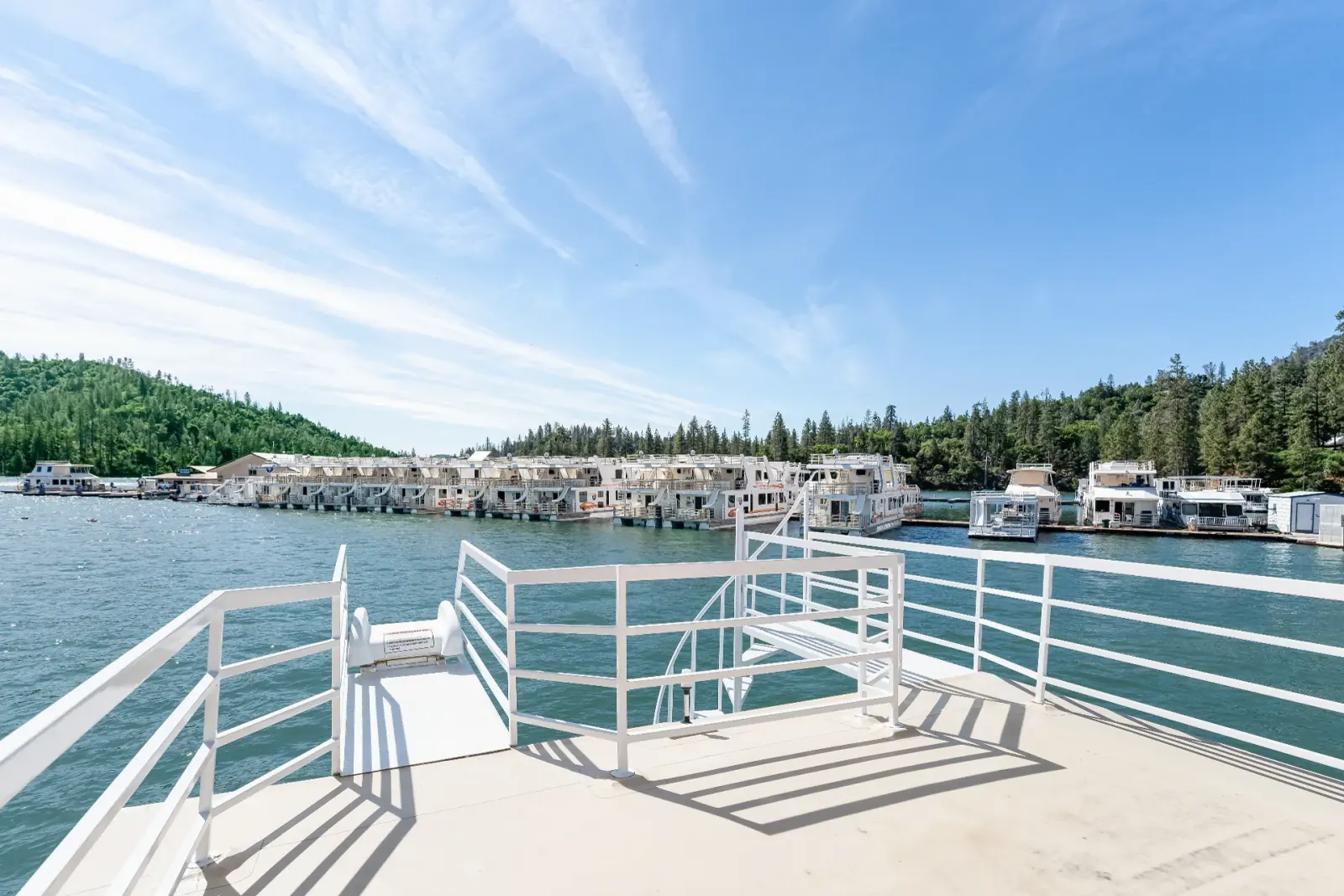 Senator houseboat spacious upper sun deck with panoramic Shasta Lake marina views and outdoor seating