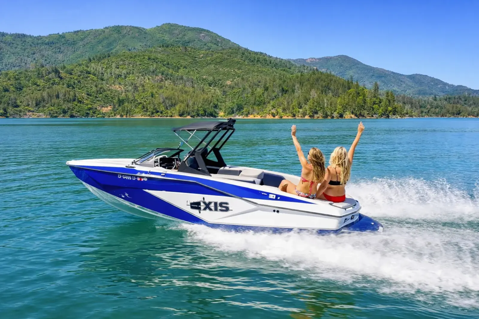 Axis T220-R wakeboard boat with riders on Shasta Lake at Silverthorn Resort