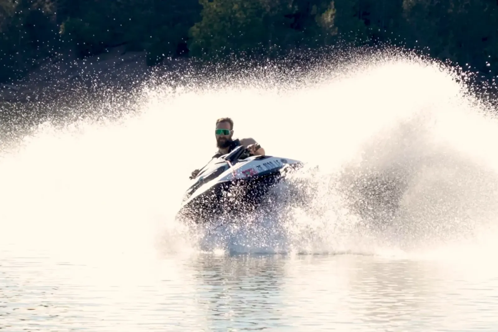 SeaDoo jet ski throwing a massive rooster tail spray on Shasta Lake near Silverthorn Resort