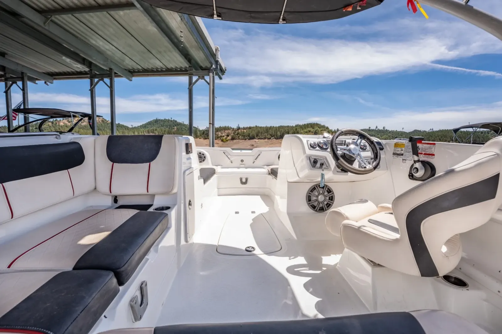 Tahoe Deck Boat 150 cockpit interior with helm station and seating at Silverthorn Resort on Shasta Lake